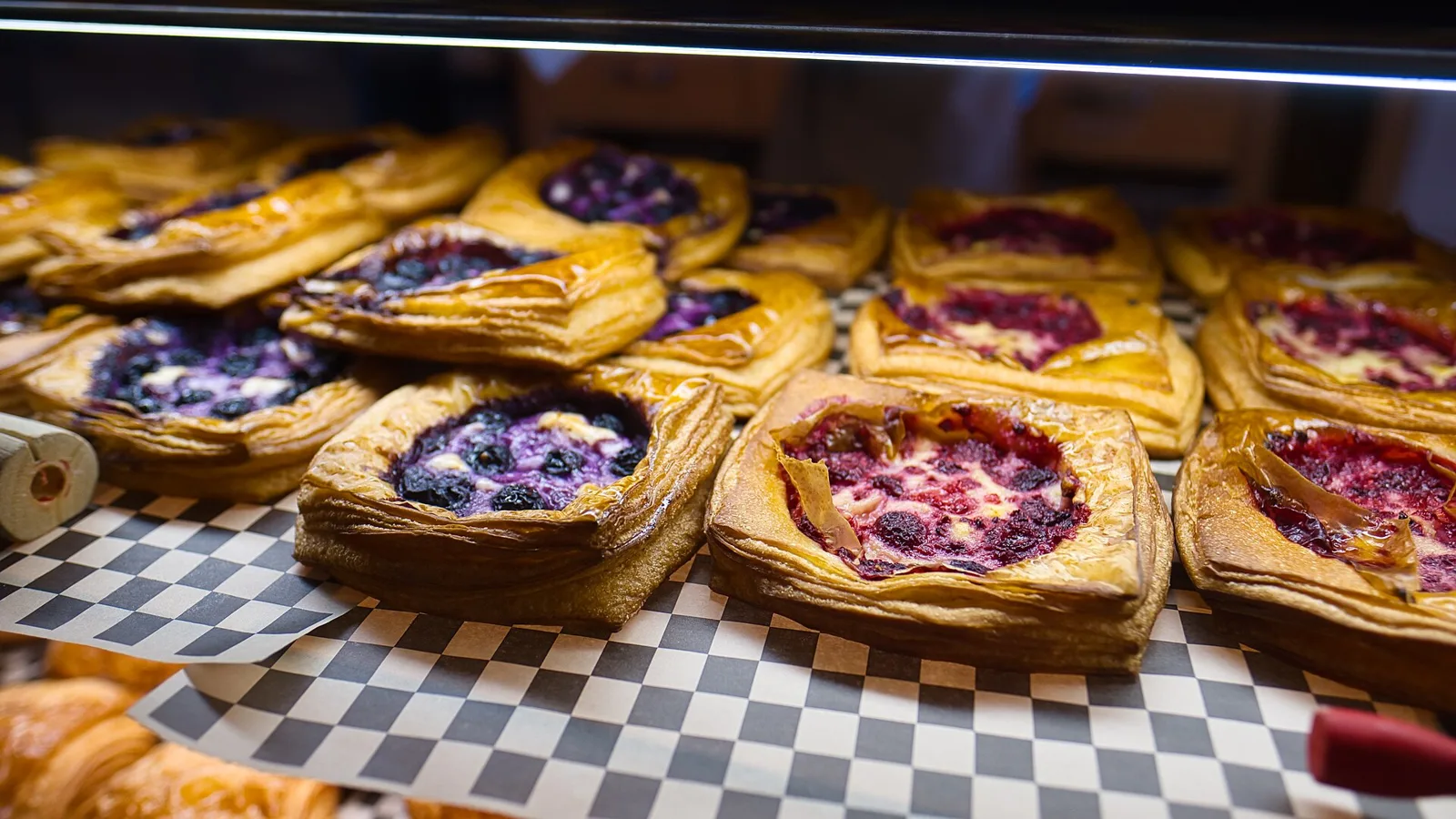 Pastries on display in a bakery case. The photo was not taken in Davie.