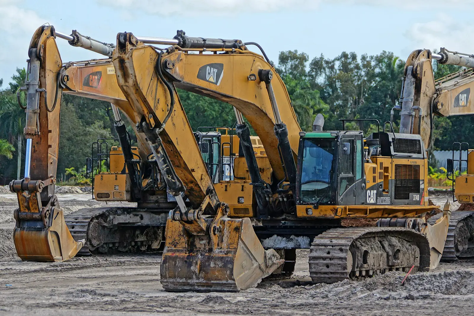Heavy construction equipment on a site in a Davie field.